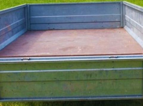 Hoe ver mag de lading van een aanhanger uitsteken?